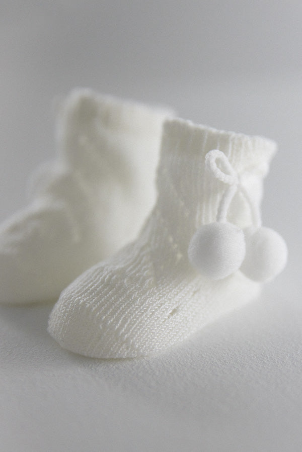 Ivory newborn pearl socks with tassels