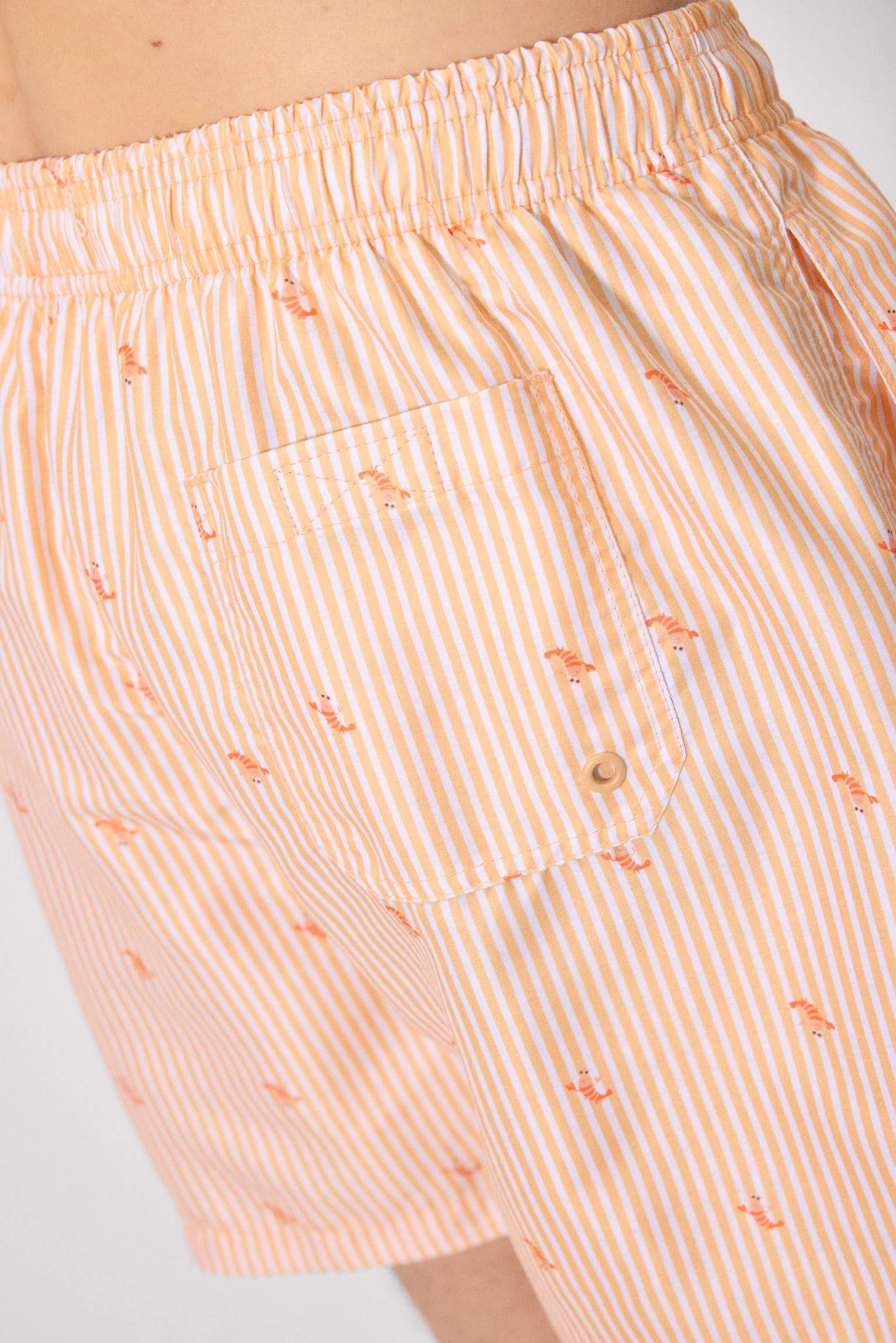 Bañador medio estampado rayas y mini langostas naranja
