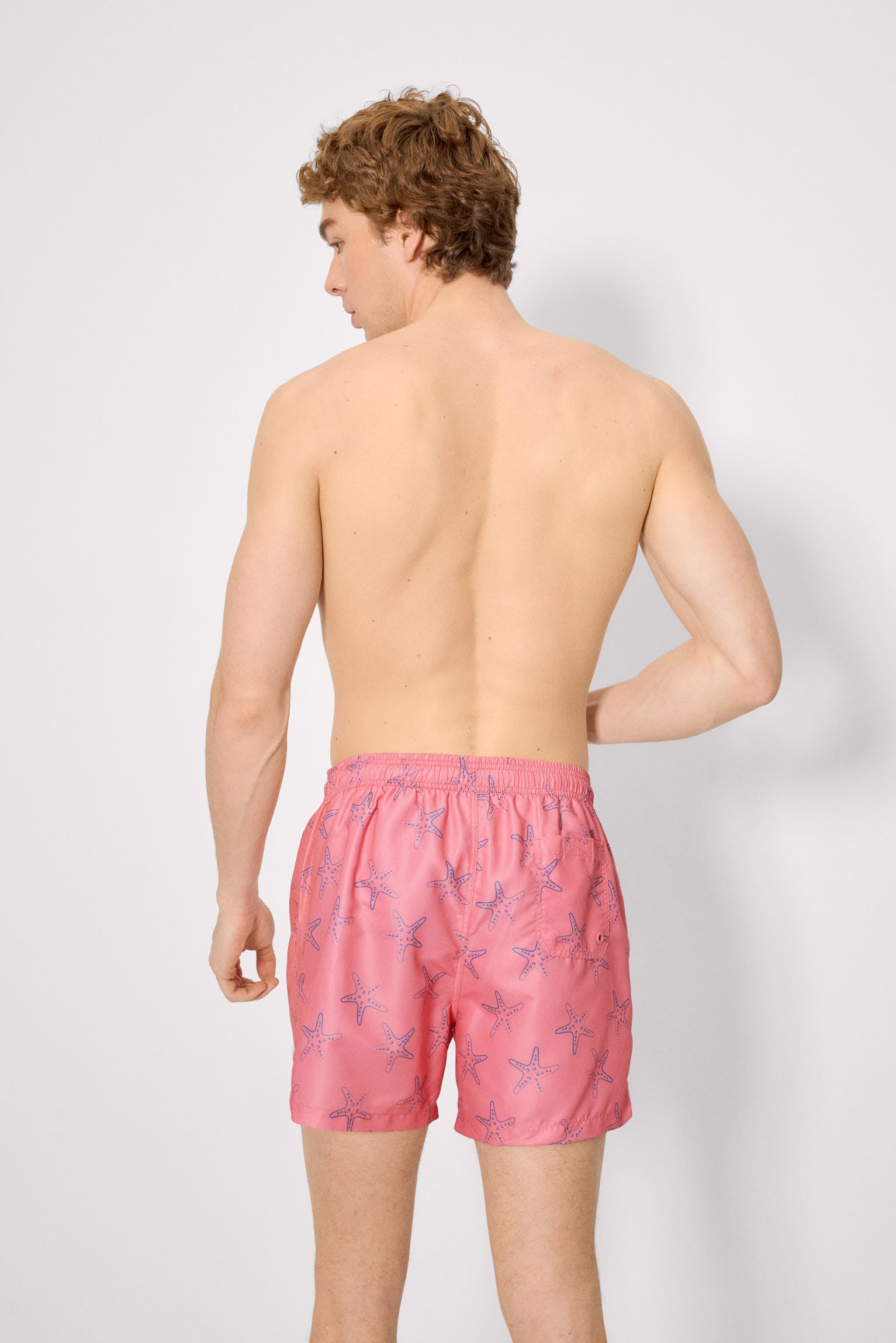 Bañador medio estampado estrellas mar rosa