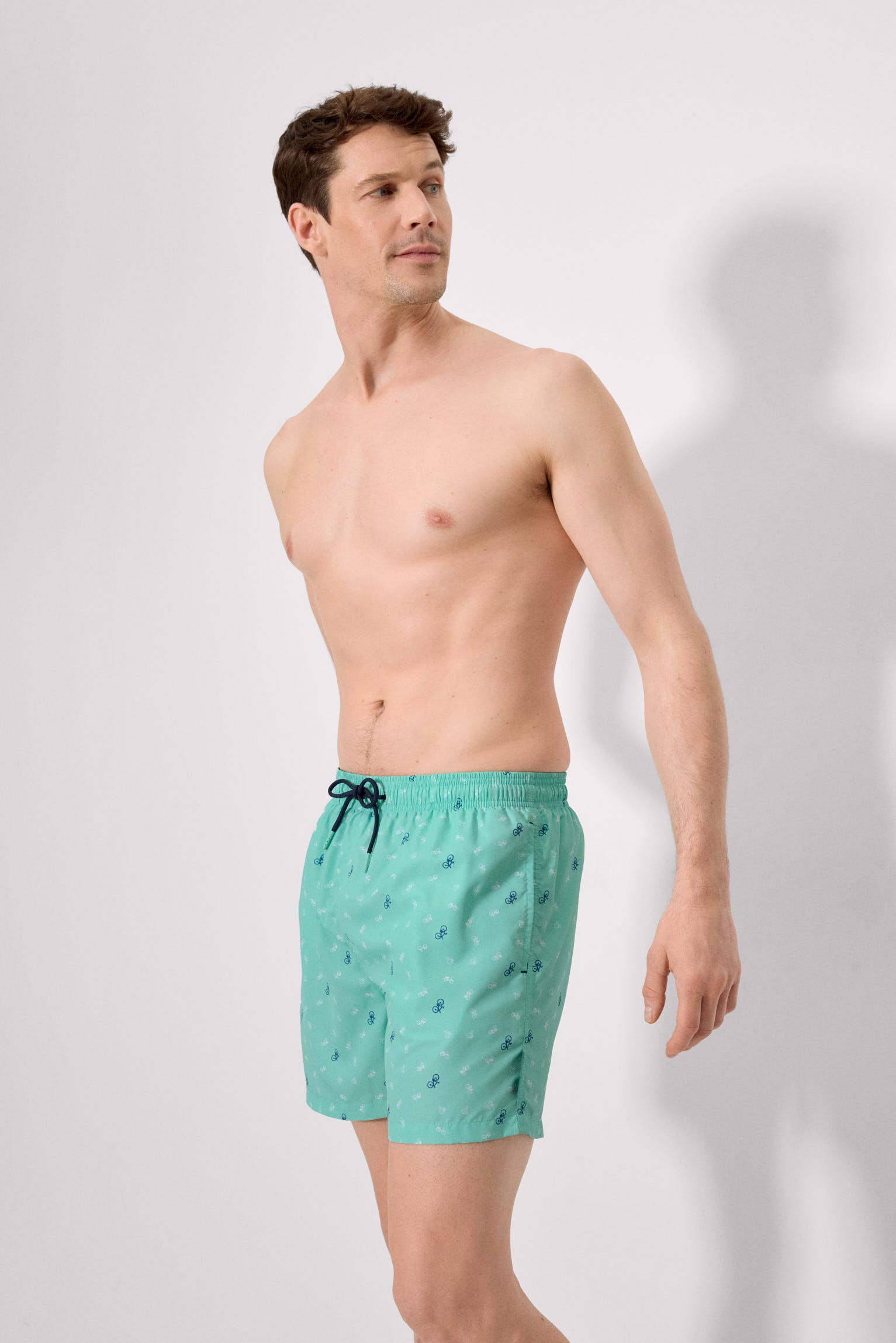 Bañador medio estampado bicicletas verde