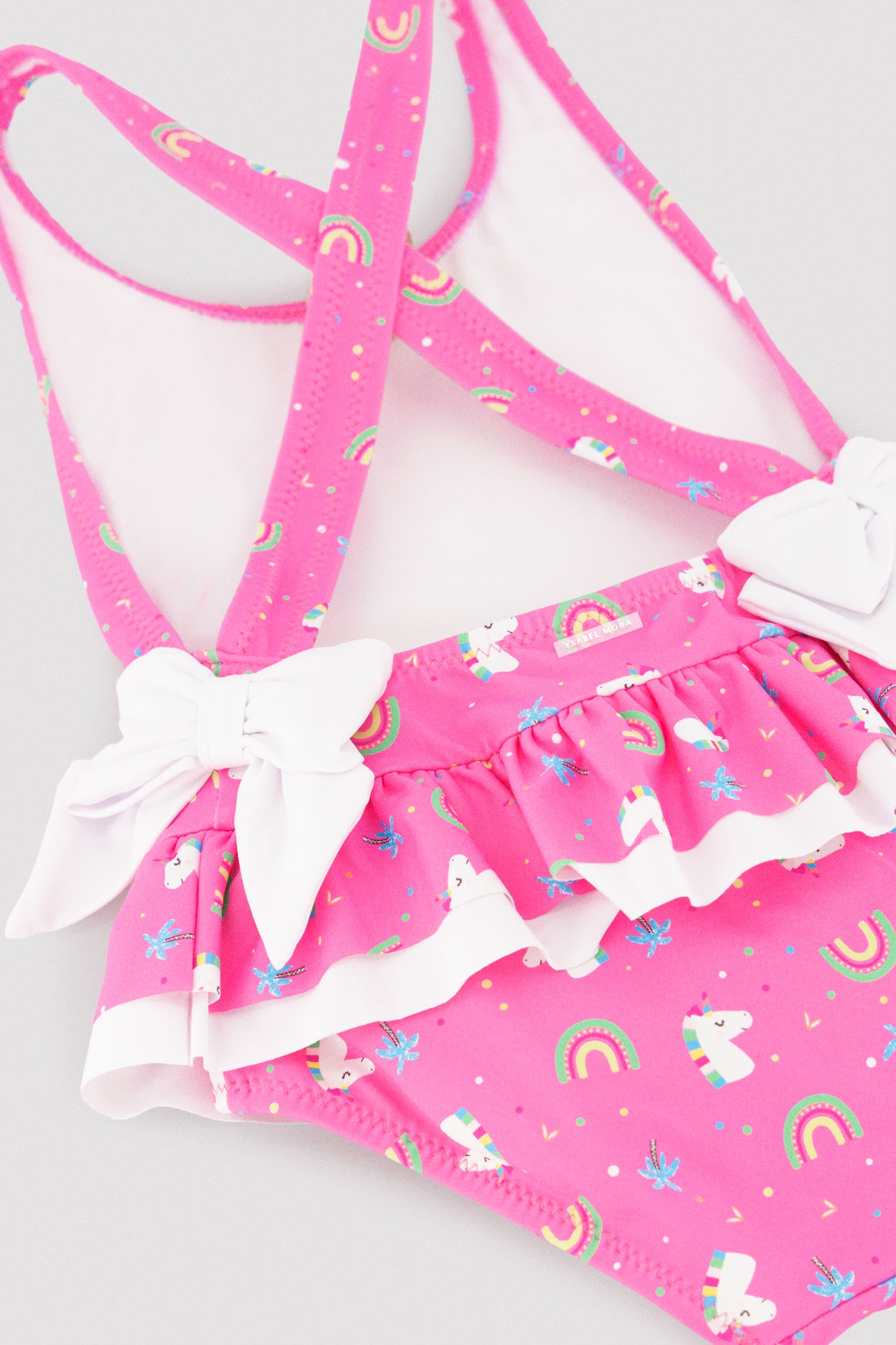 Bañador niña detalles volantes y lazos estampado unicornios