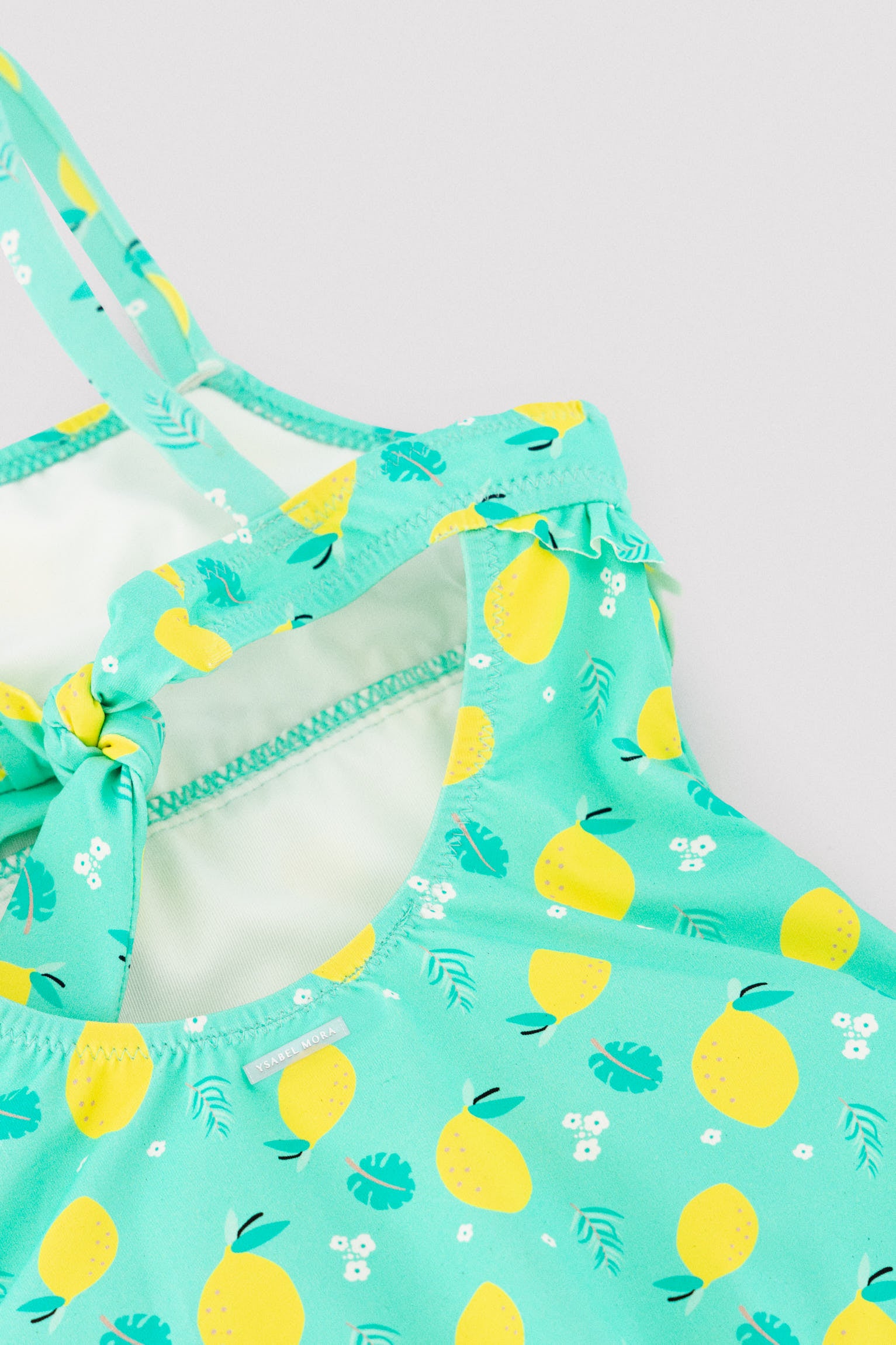 Bañador niña detalle volante estampado limones