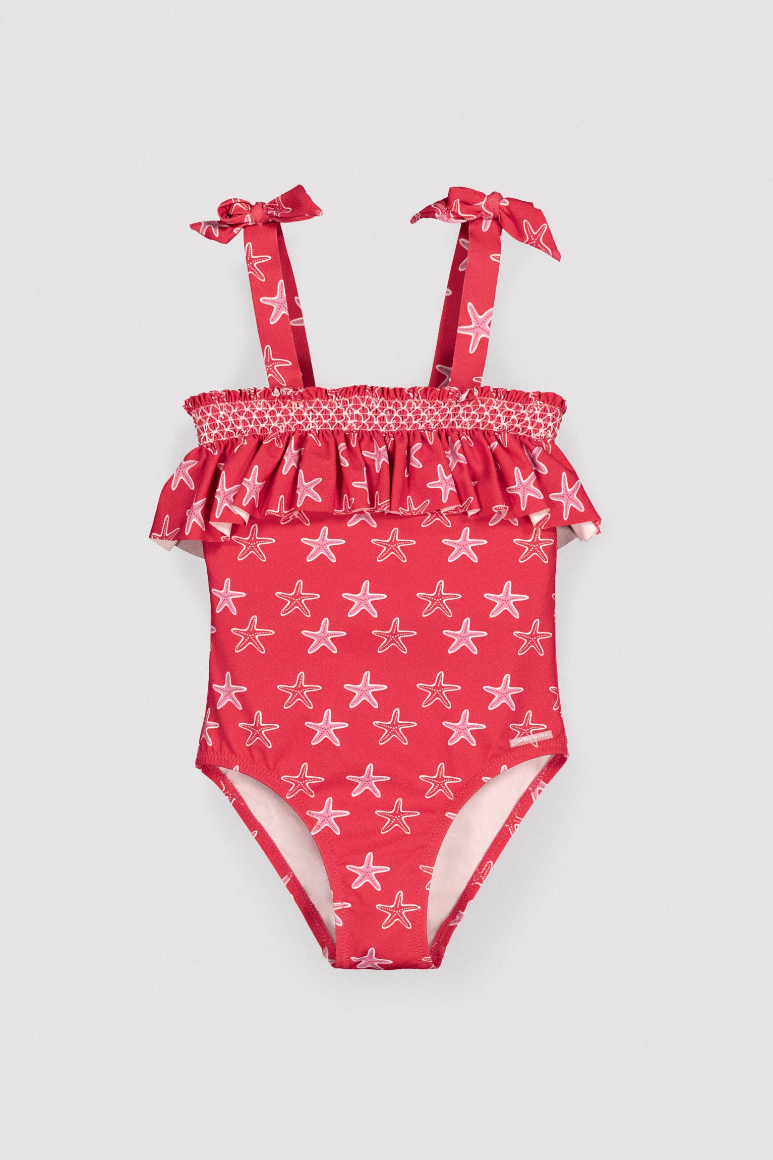 Bañador niña detalle volante estampado estrellas marinas - Ysabel Mora