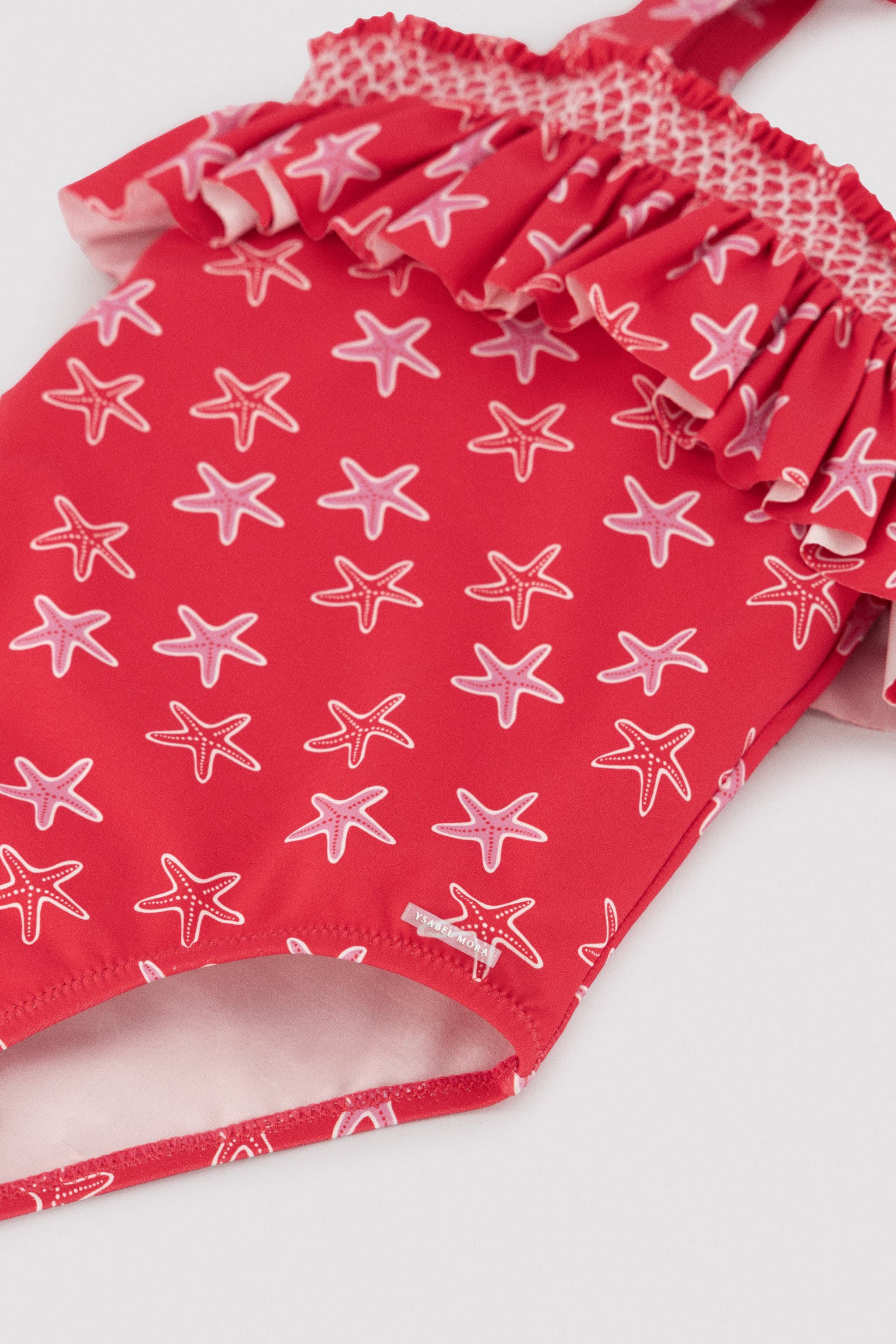 Bañador niña detalle volante estampado estrellas marinas - Ysabel Mora
