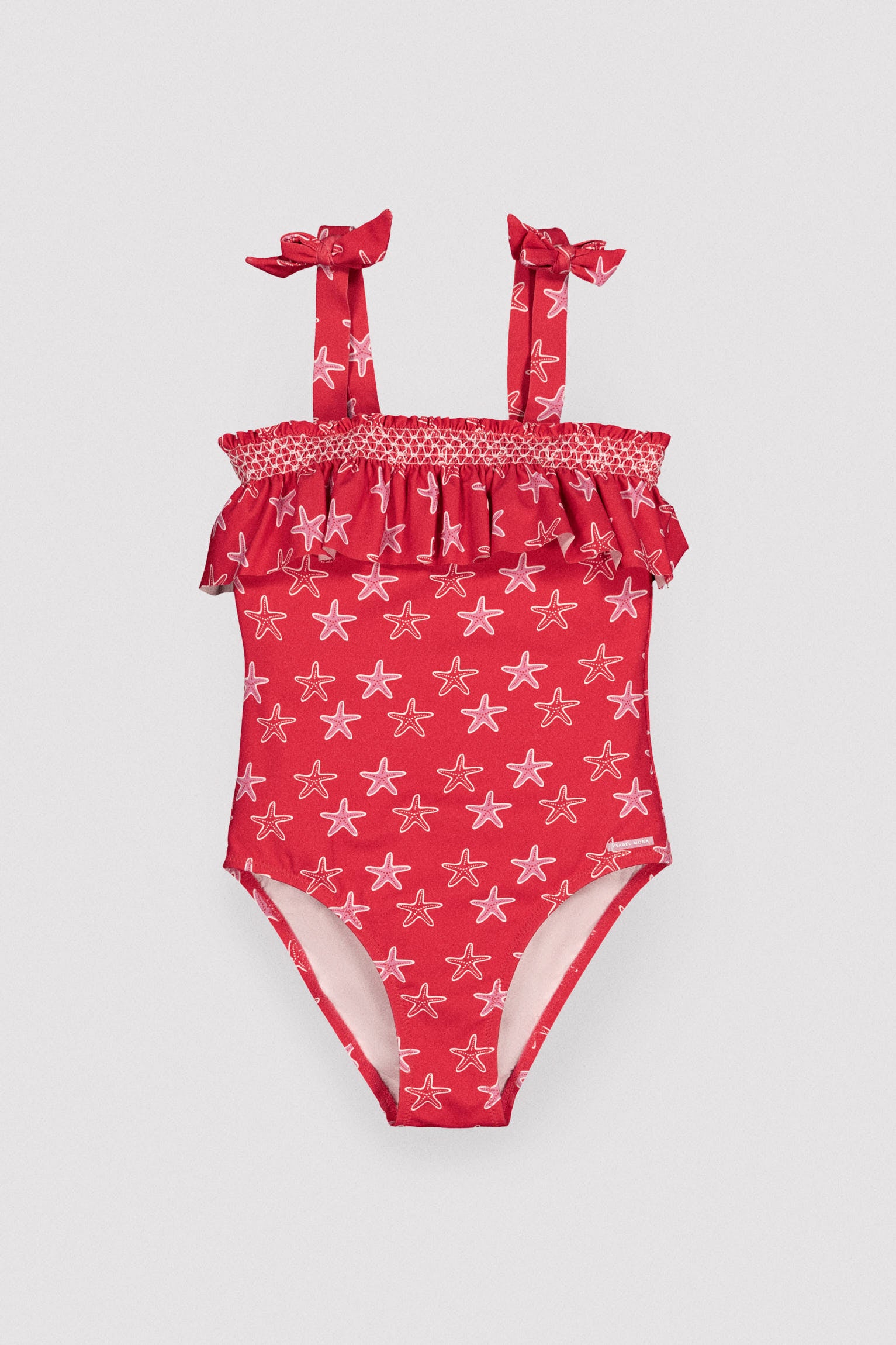 Bañador niña detalle volante estampado estrellas marinas - Ysabel Mora