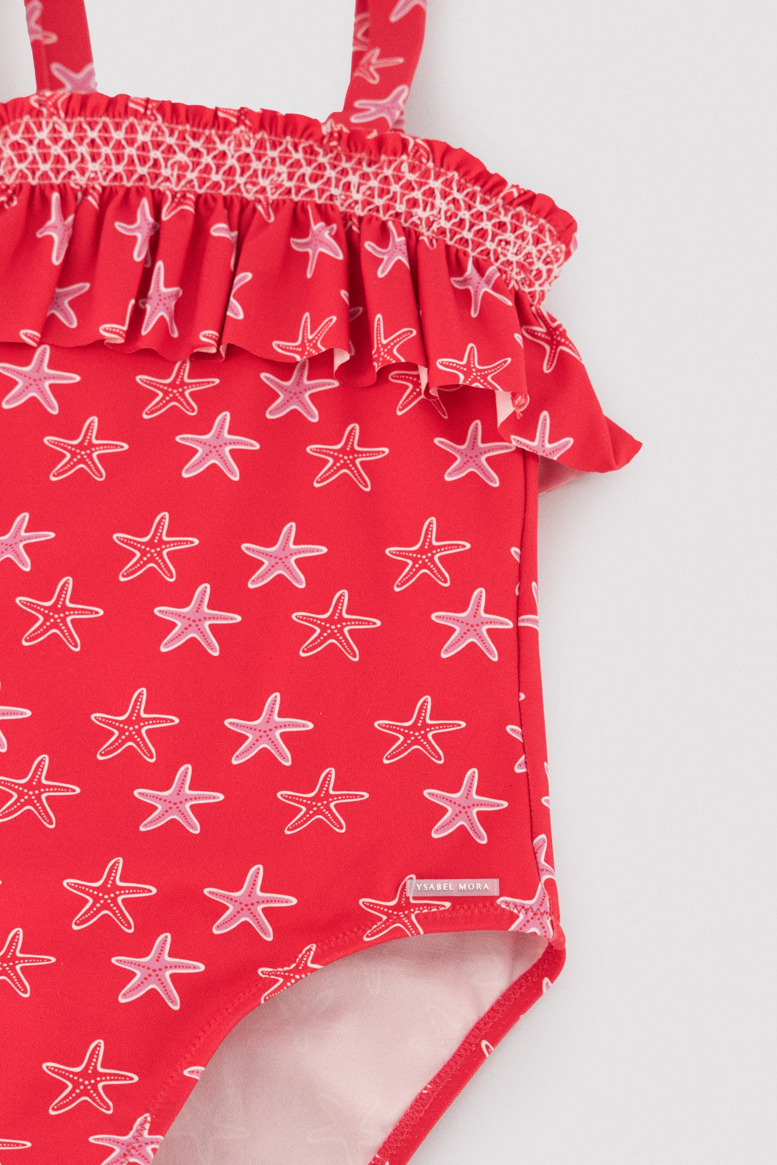 Bañador niña detalle volante estampado estrellas marinas