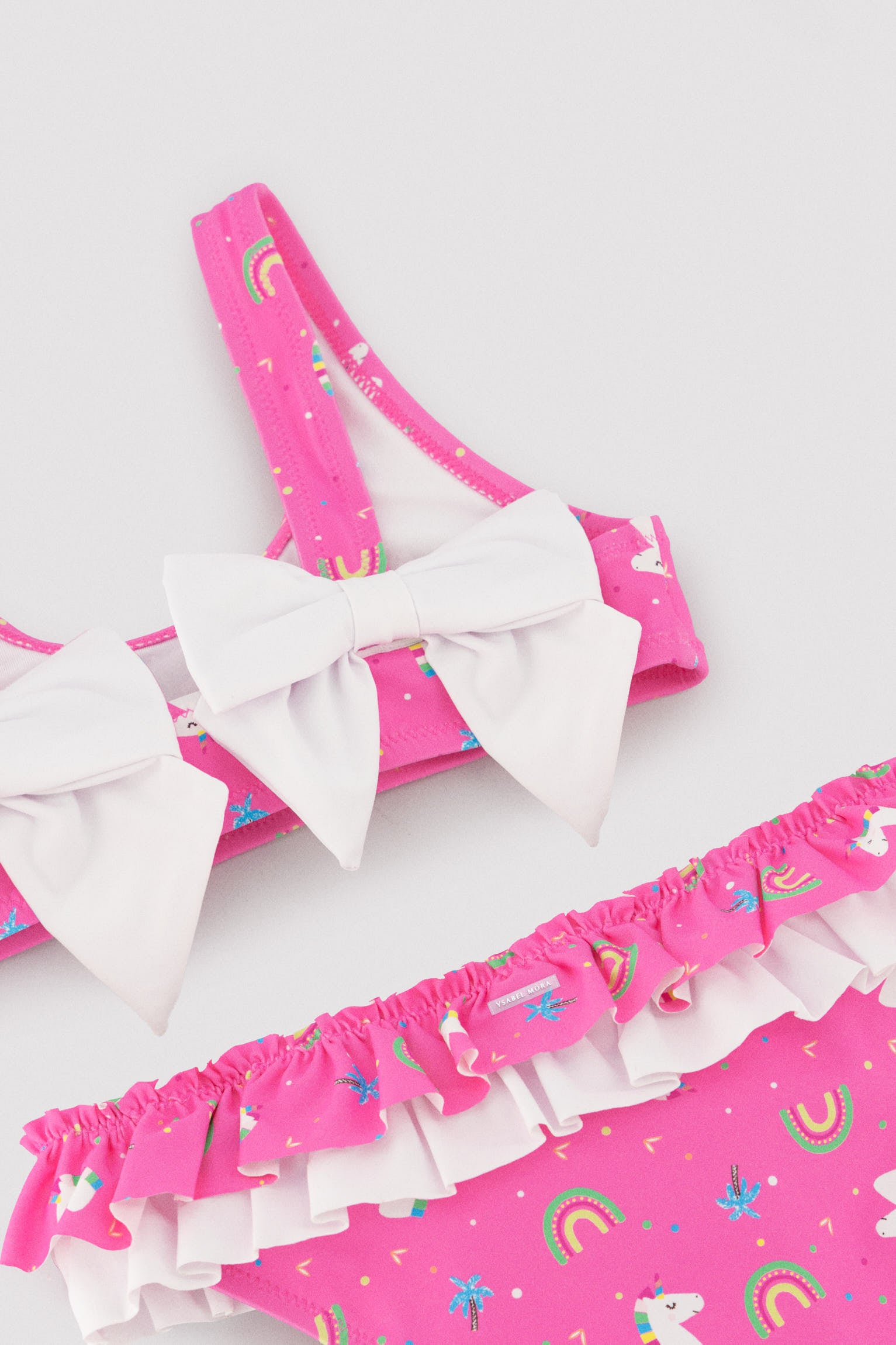 Bikini niña detalle volantes y lazos estampado unicornios