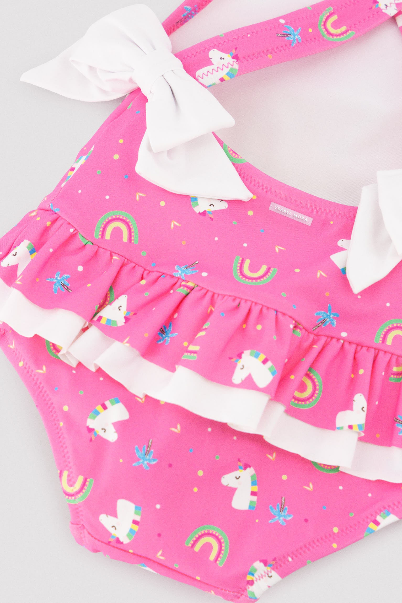 Bañador bebé niña detalles volantes y lazos estampado unicornios - Ysabel Mora