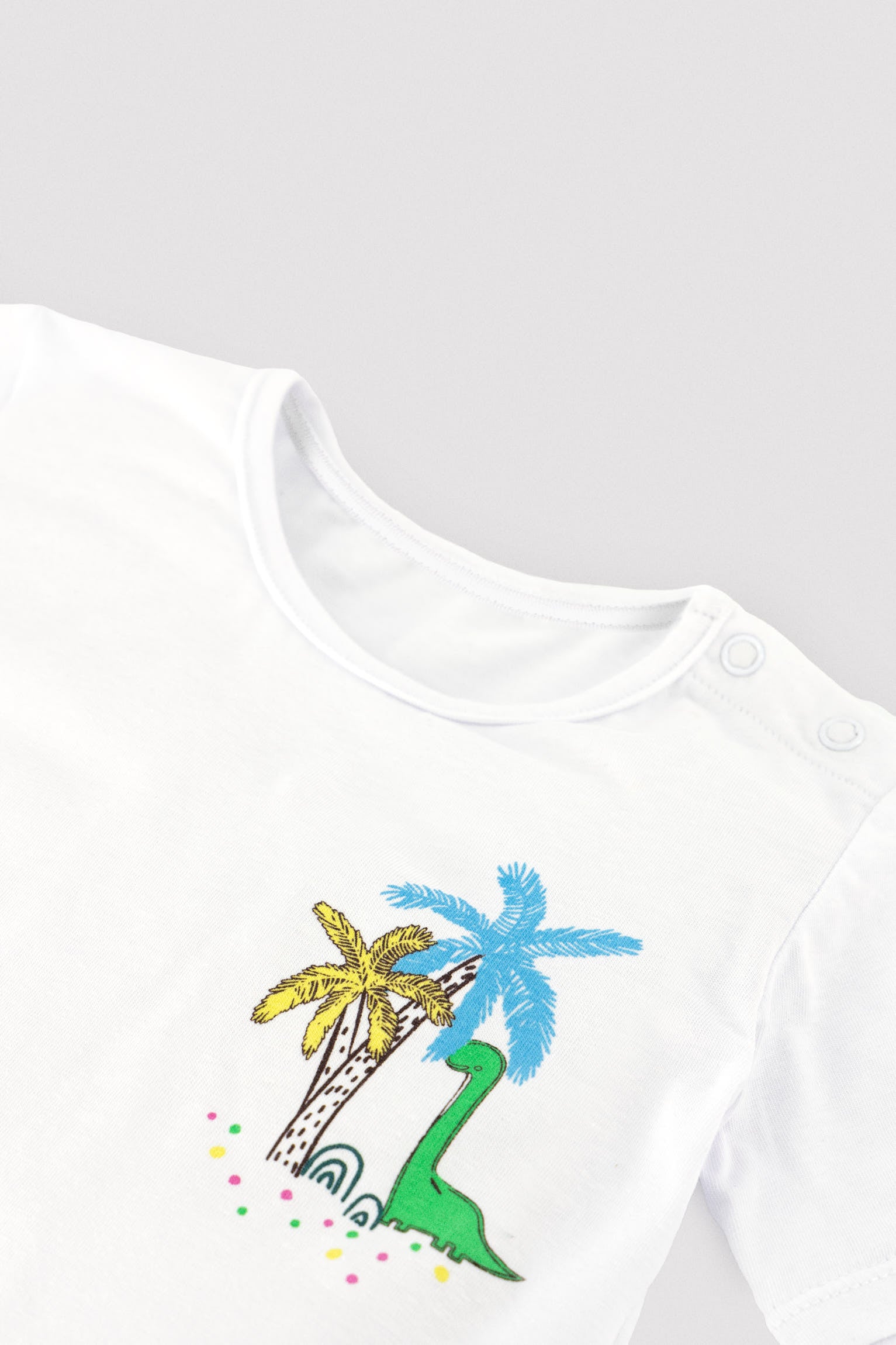 Conjunto camiseta y bañador bóxer bebé estampado dinosaurios