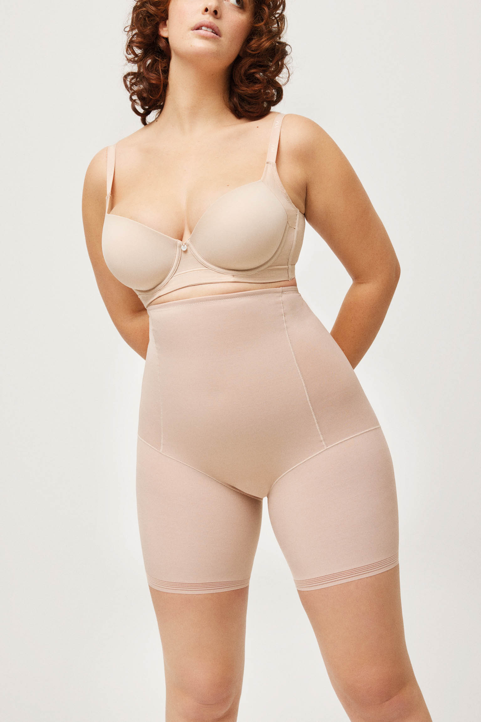 Wearing our strapless faja in nude, custom size XS waist/ 3XL hips