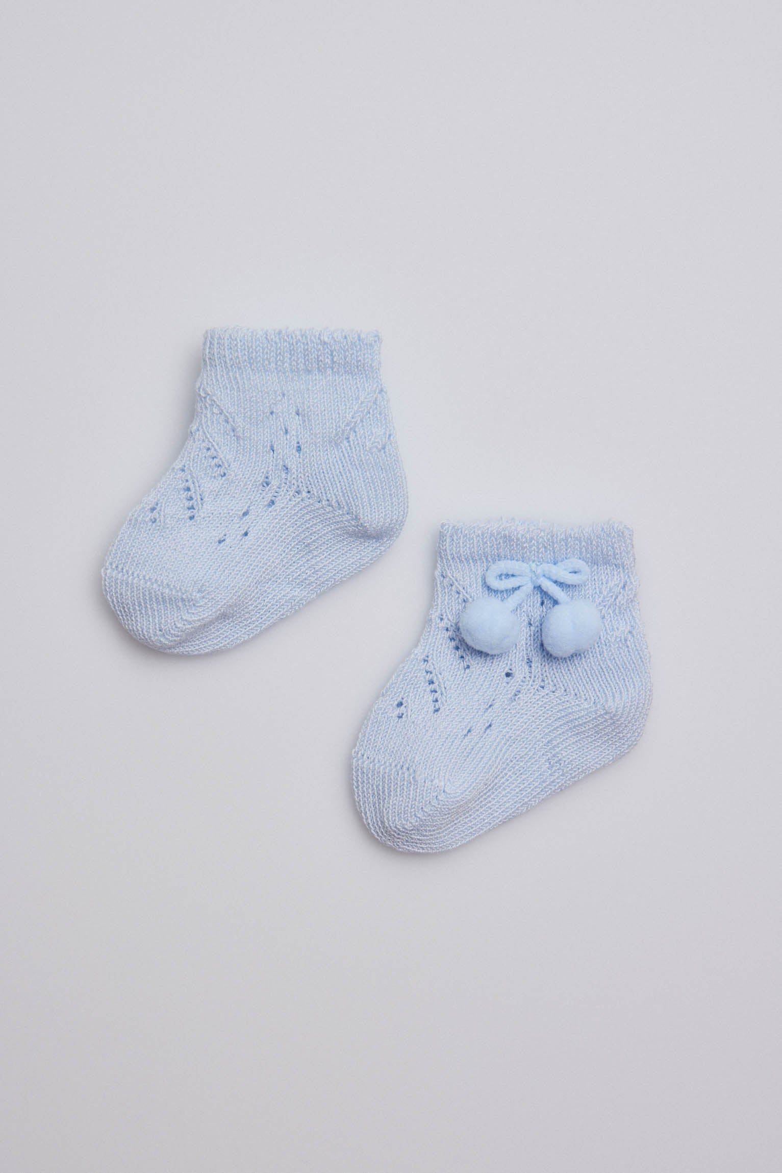 Light blue newborn pearl socks with tassels