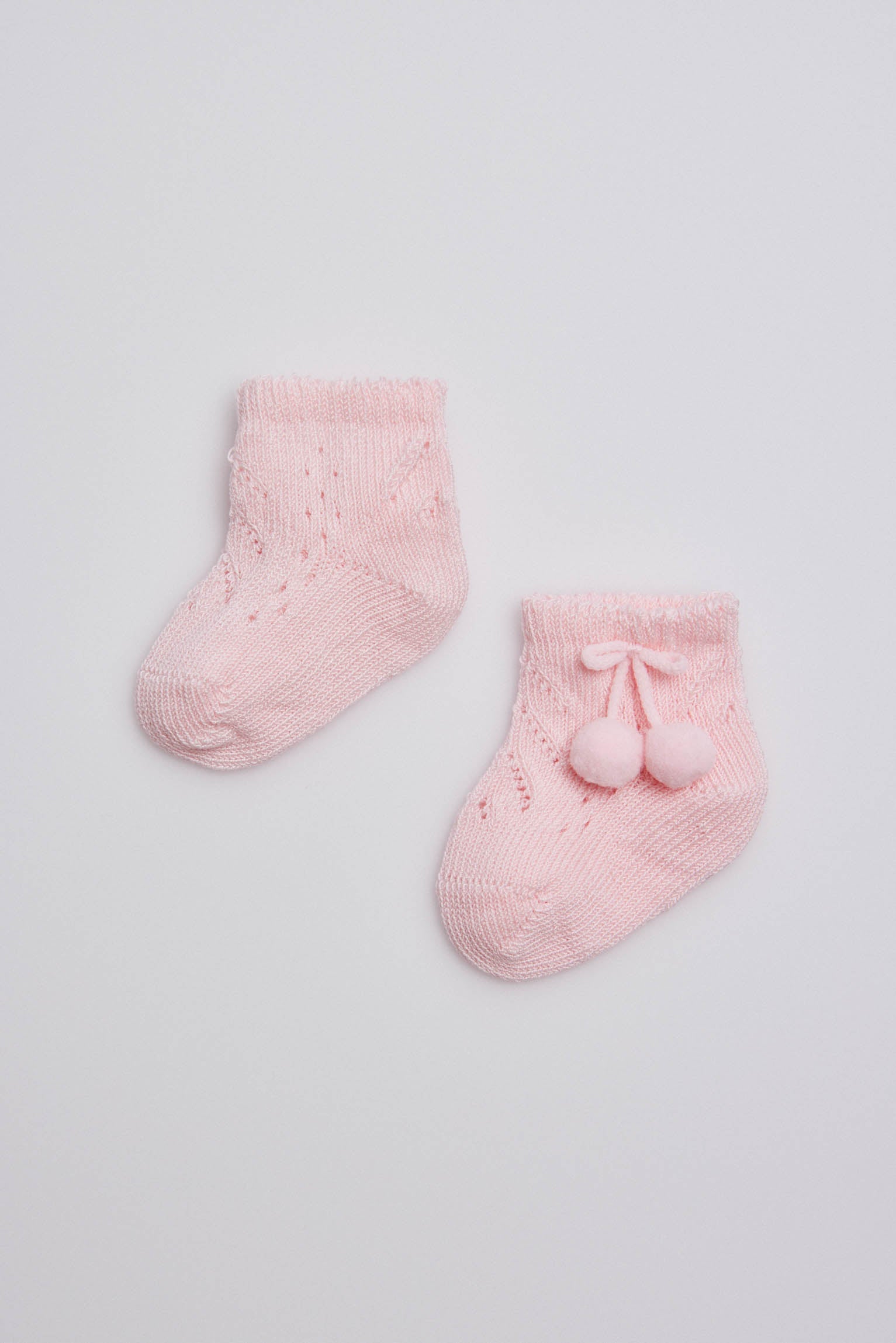 Pink newborn pearl socks with tassels