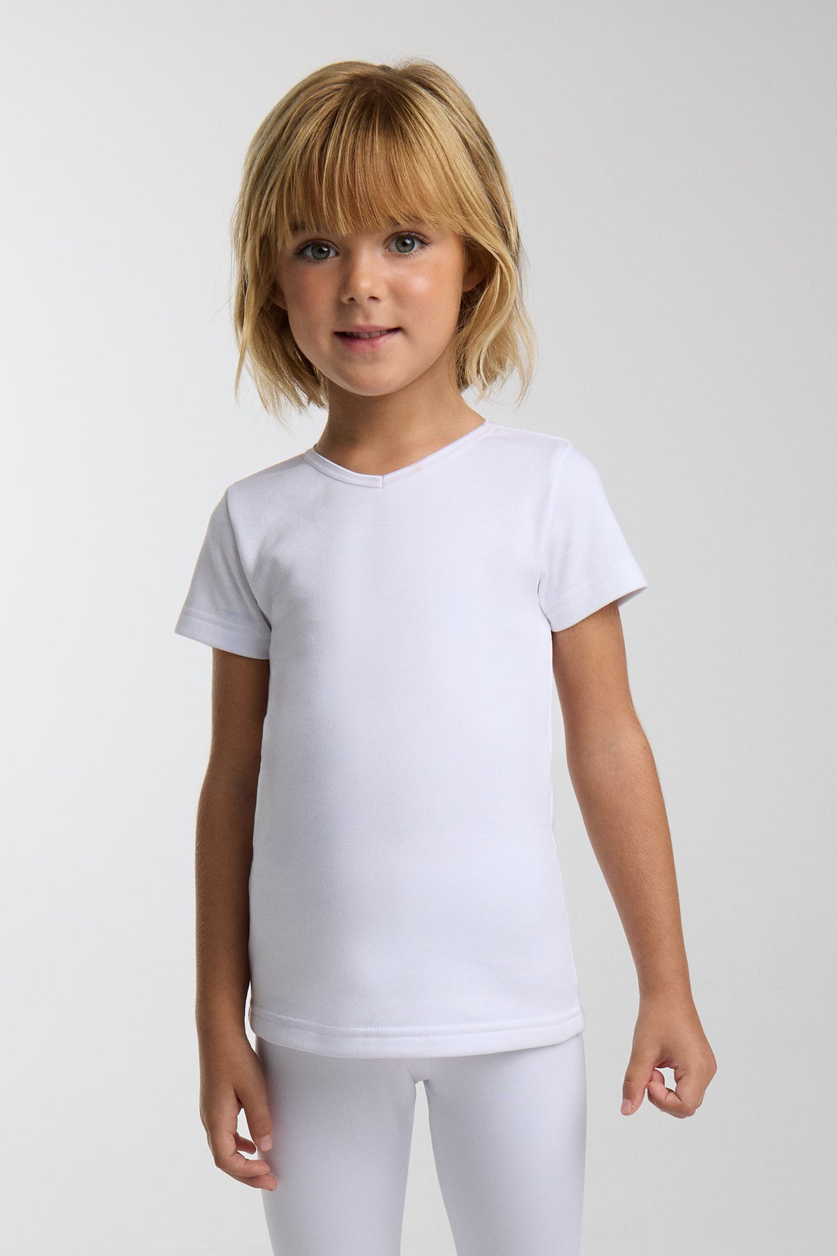 TÉRMICO LIGERO Camiseta infantil manga corta cuello pico blanco
