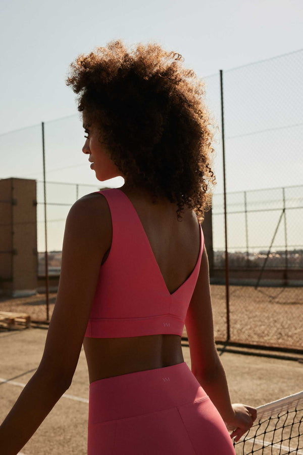 Cut out sports bra with coral V-neckline