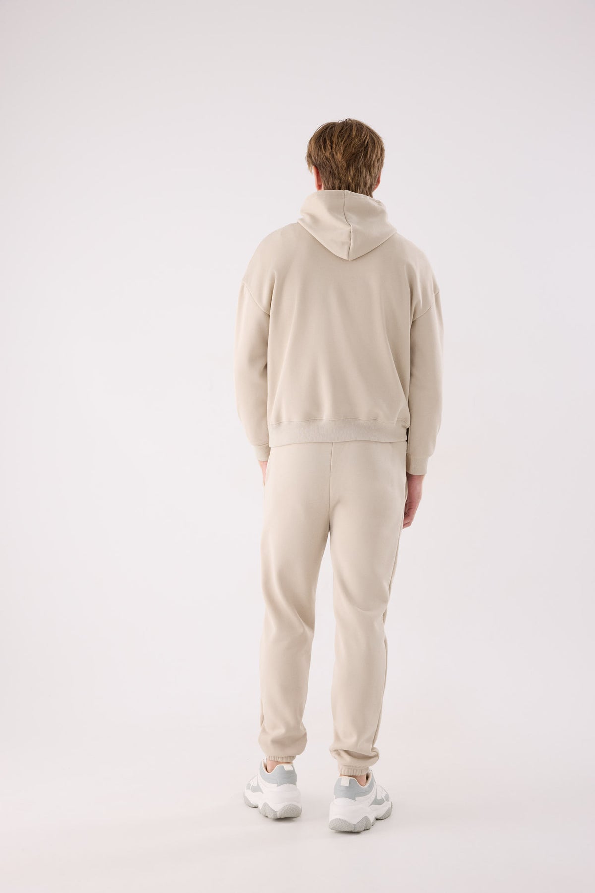 Pantalón deportivo hombre jogger afelpado con cintura ajustable beige