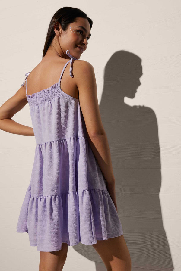 Short strap dress with gathered bow and lilac ruffles