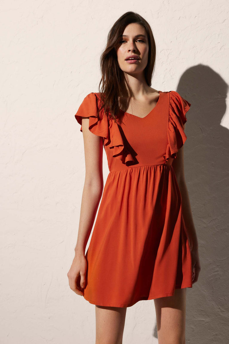 Short beach dress with bow detail on the orange back