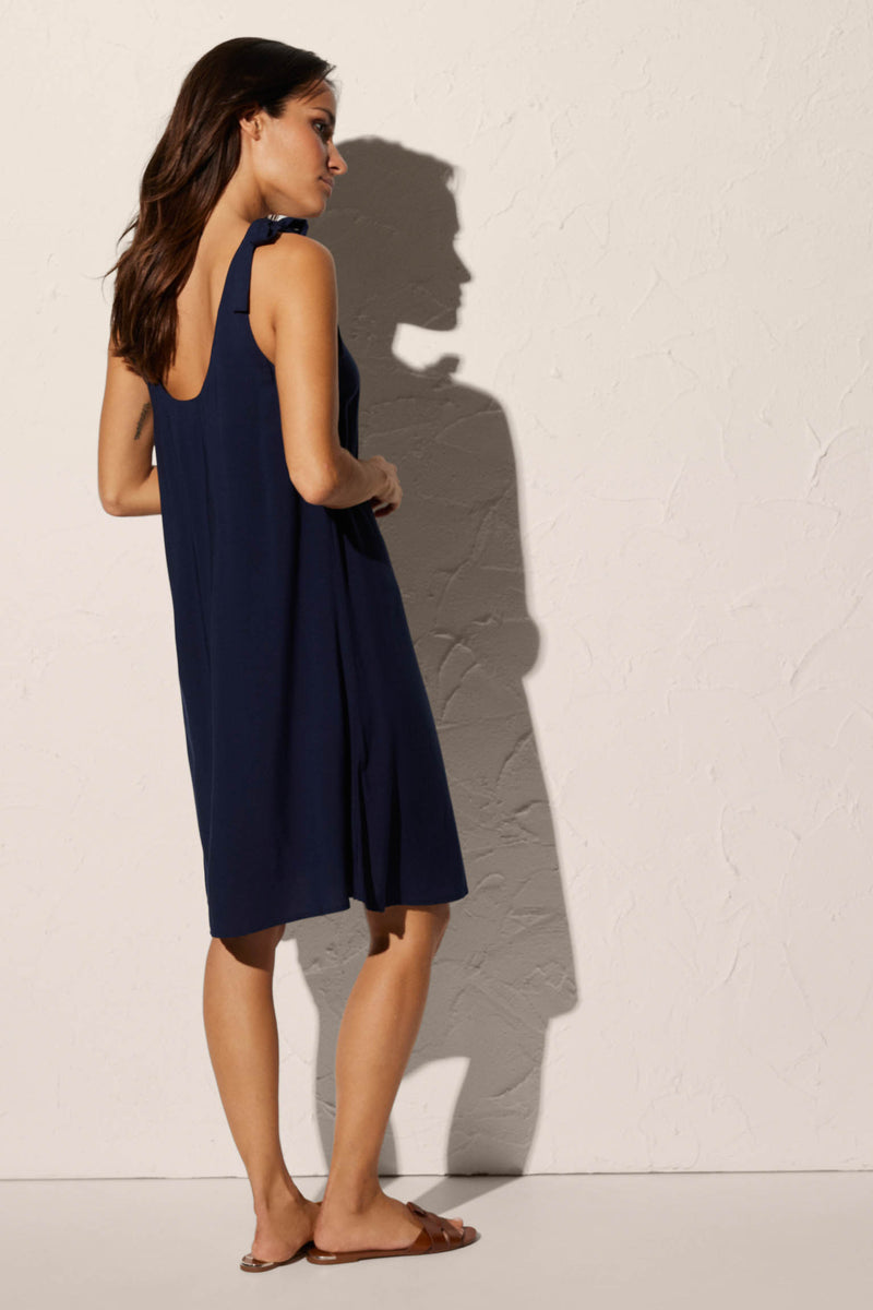 Short strapless beach dress with navy bow detail