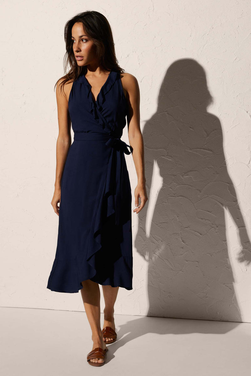 Knee-length beach dress with bow detail and navy ruffles