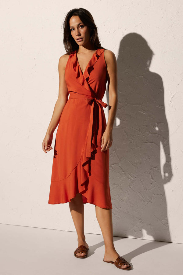 Knee-length beach dress with bow detail and orange ruffles