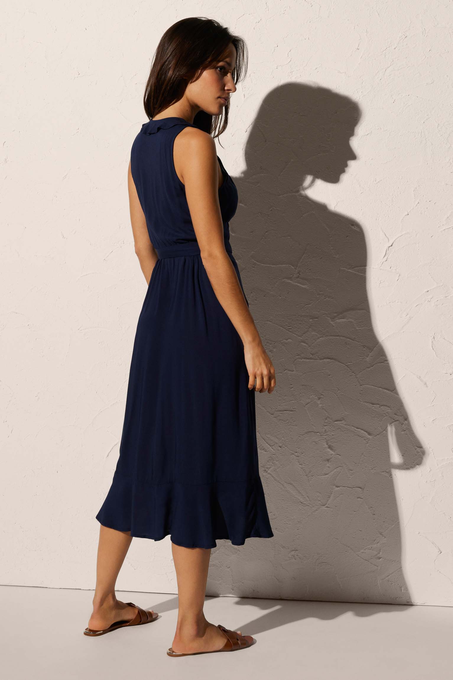 Knee-length beach dress with bow detail and navy ruffles