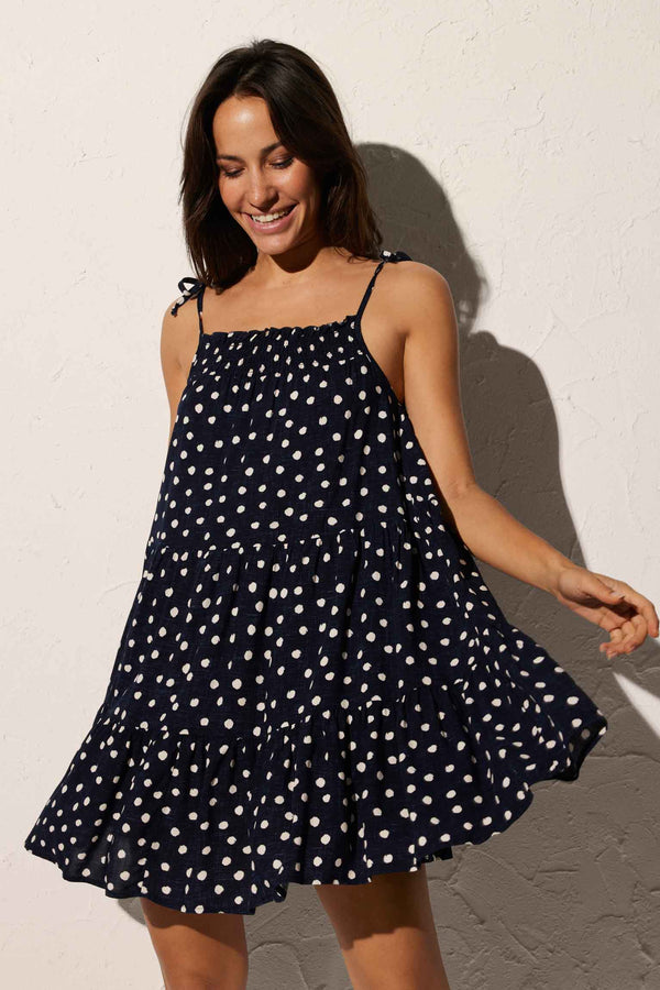 Short beach dress with knotted straps in navy plumeti print