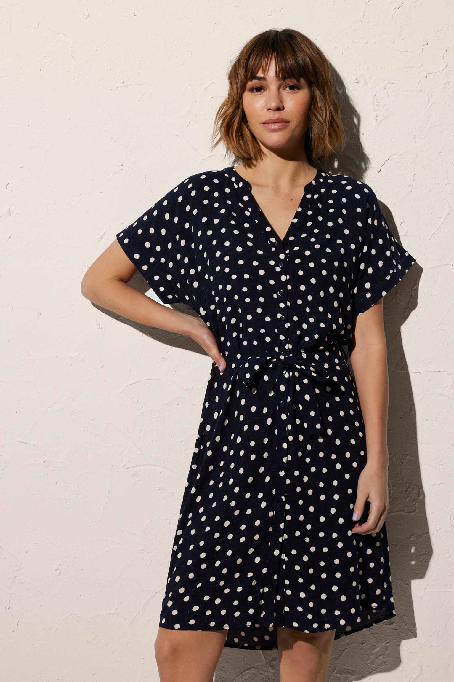 Short plumeti print beach dress with navy bow detail