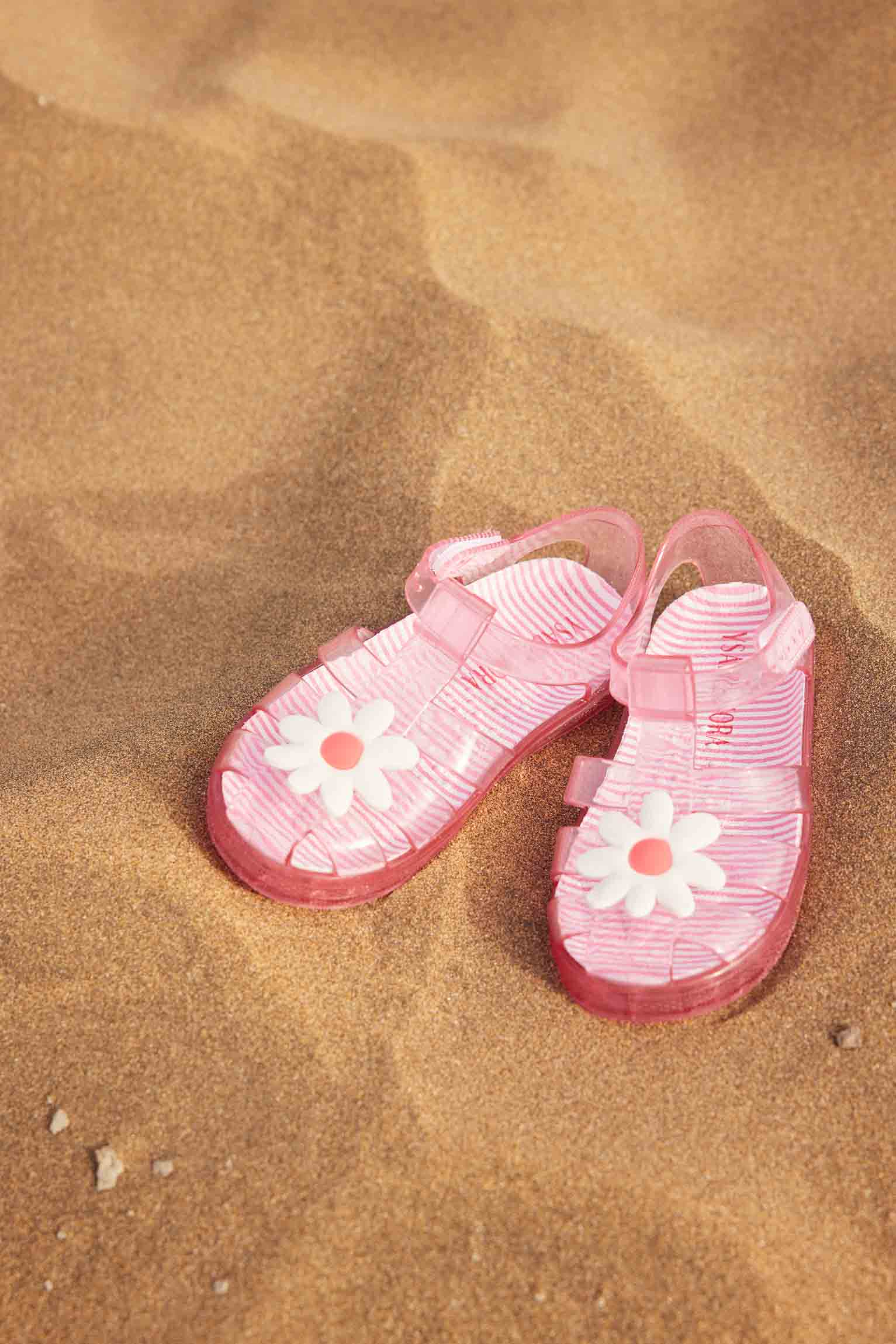 Cangrejeras de playa niña estampado a rayas y detalle de flor