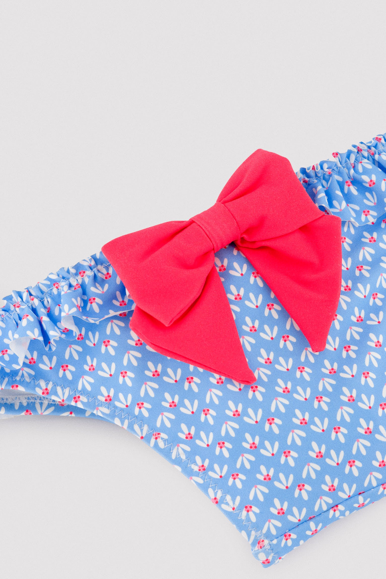 Culetín bebé detalles volantes y lazos estampado flores